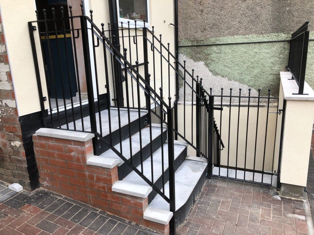 Bespoke wrought iron fence and railing installed at a property