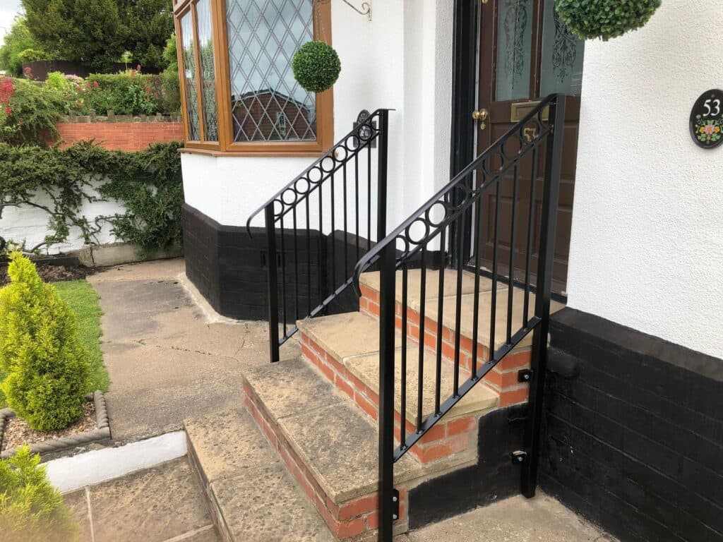 Decorative wrought iron banister with detailed fabrication
